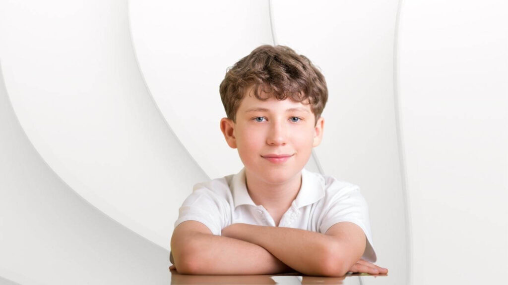 Male children aged up to 11 years sitting patiently in a clinic environment