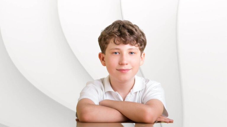 Male children aged up to 11 years sitting patiently in a clinic environment